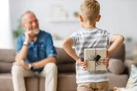 boy hiding grandpa gift behing back ca